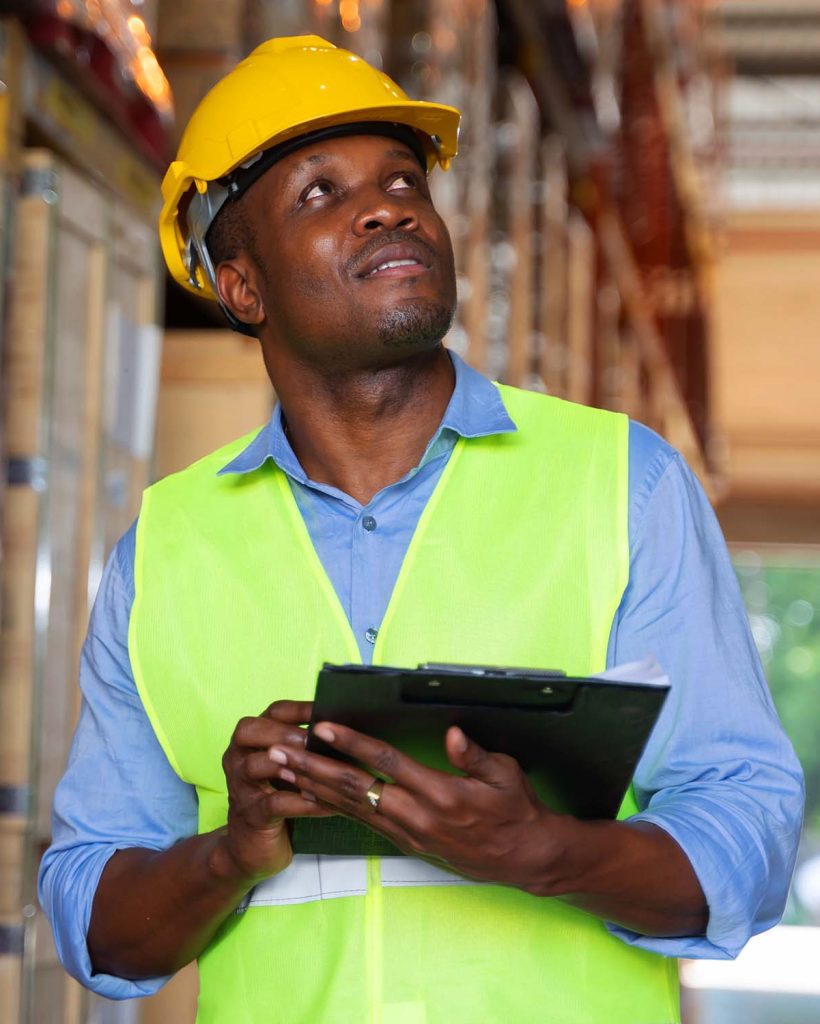 african-american-man-checking-stock-working-in-a-w-FD4C6R2.jpg